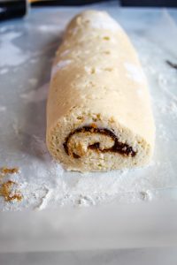 gluten free cinnamon rolls rolled on a white counter