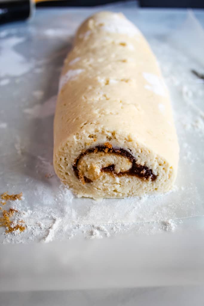 gluten free cinnamon rolls rolled on a white counter