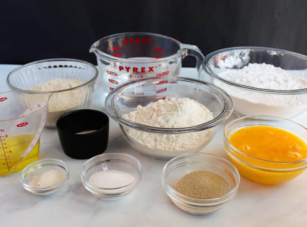 gluten free artisan bread ingredients on a white counter.