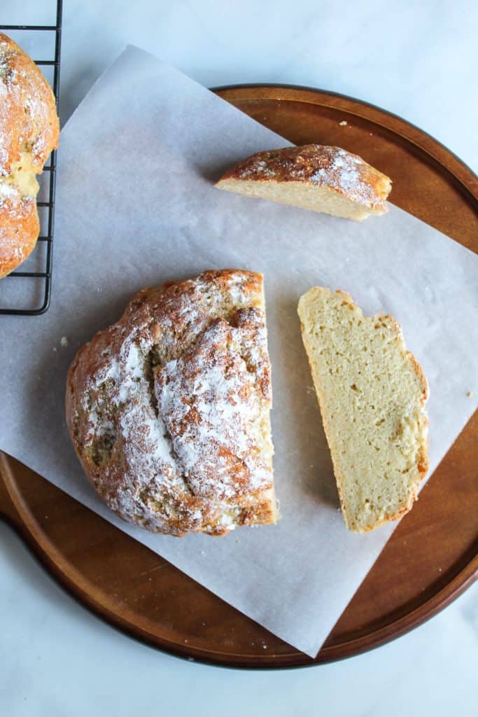 gluten free artisan bread sliced on a wooden board.