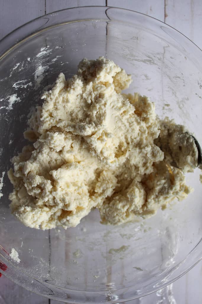 gluten-free biscuit recipe dough mixed in a glass bowl.