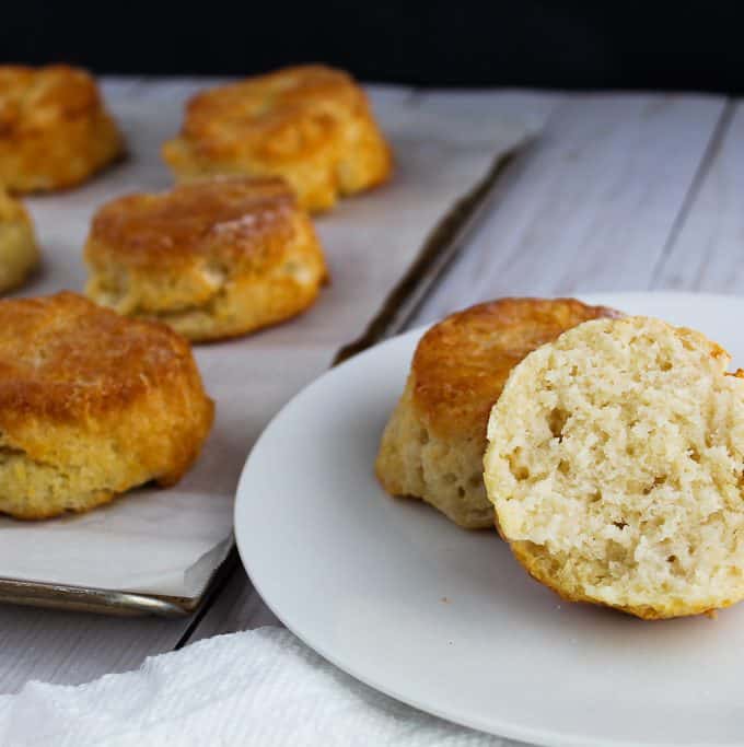 gluten free biscuits sliced on a white plate.