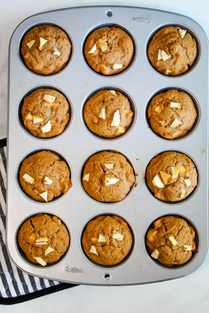 gluten free apple muffins in a baking tin