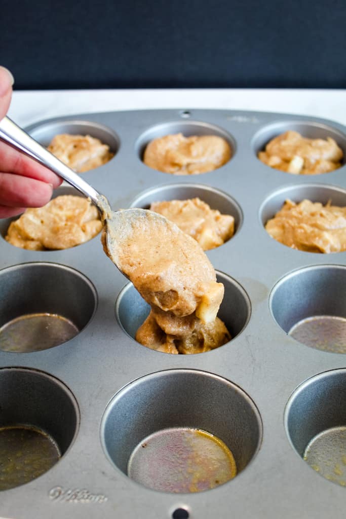 gluten free apple muffins portioned in a muffin tin