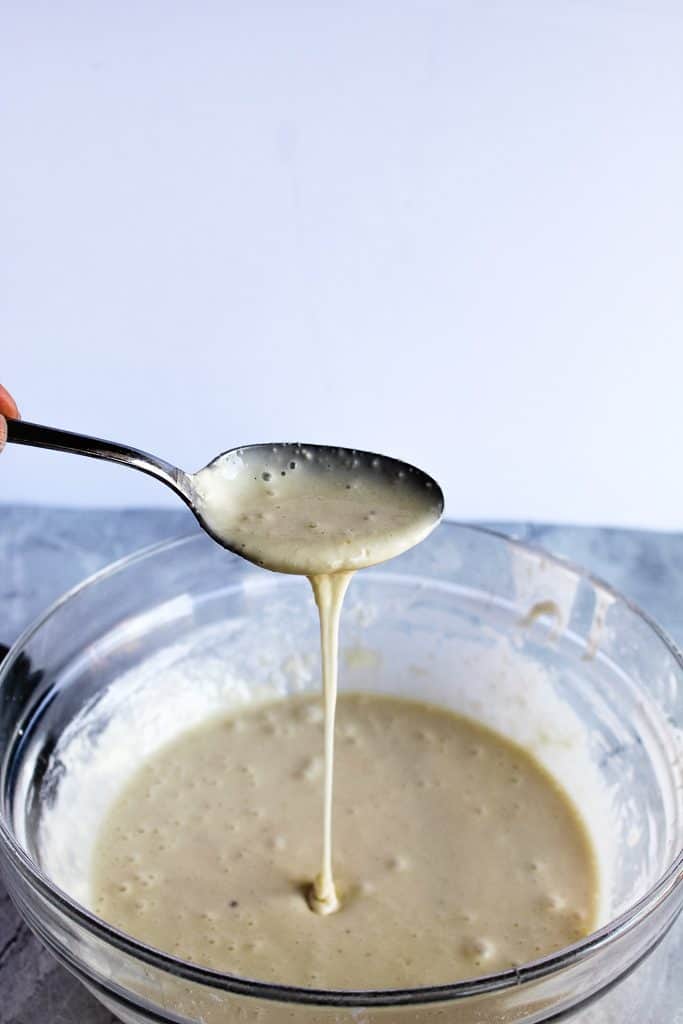 Gluten free pita bread batter on a spoon