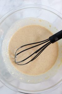 apple quinoa muffins batter in a glass bowl