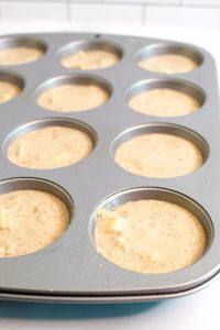 apple quinoa muffins in a muffin tin