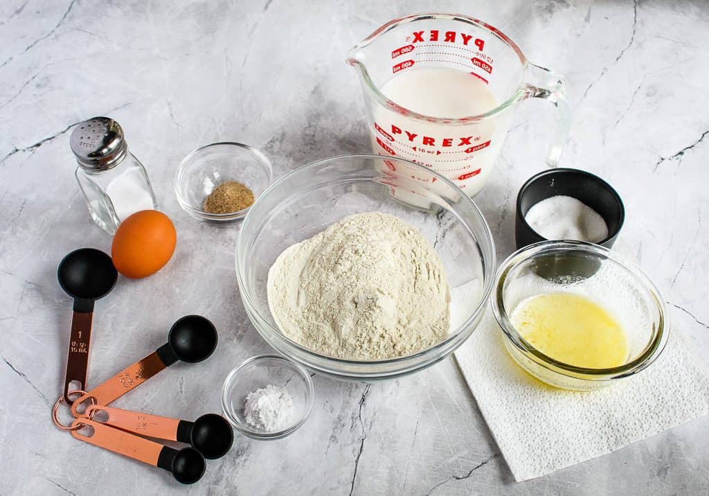ingredients of gluten free buckwheat pancakes on a white countertop