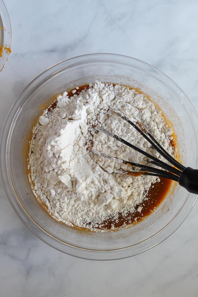 gluten free pumpkin donuts mixed in a glass bowl