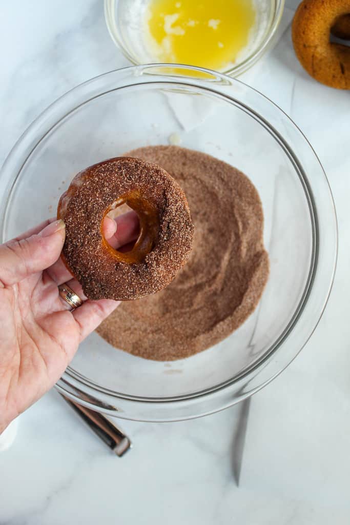 gluten free pumpkin donuts held up