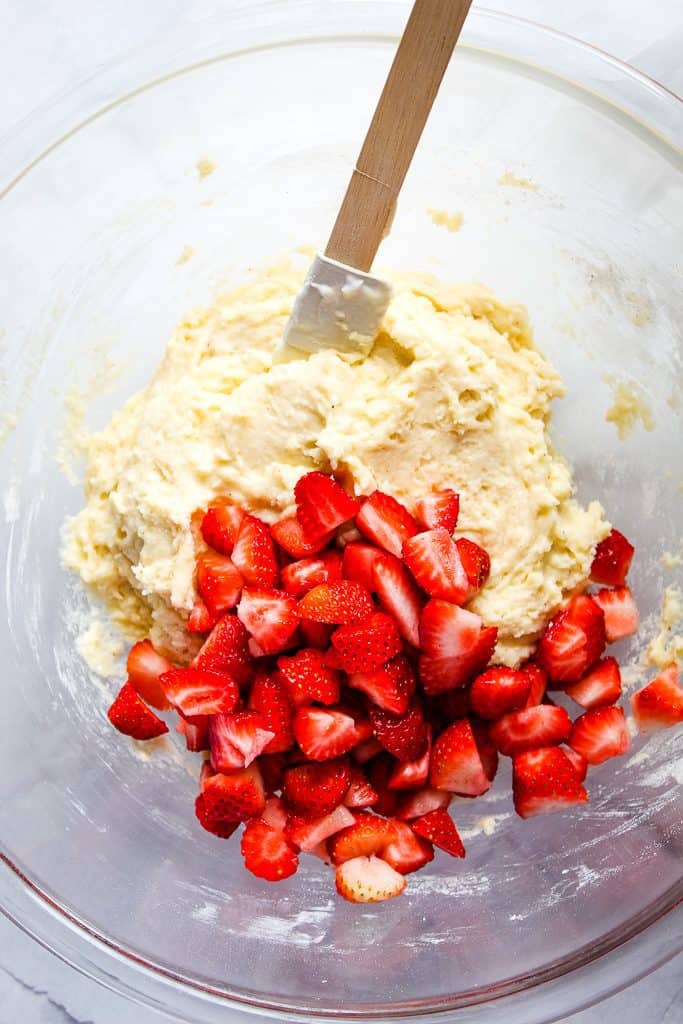 Gluten free strawberry muffins batter in a glass bowl