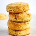 almond flour biscuits stacked on a white counter