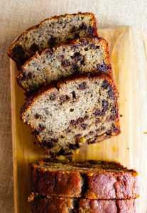 gluten free chocolate chip banana bread slices on a cutting board