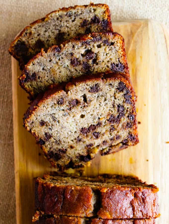 gluten free chocolate chip banana bread slices on a cutting board