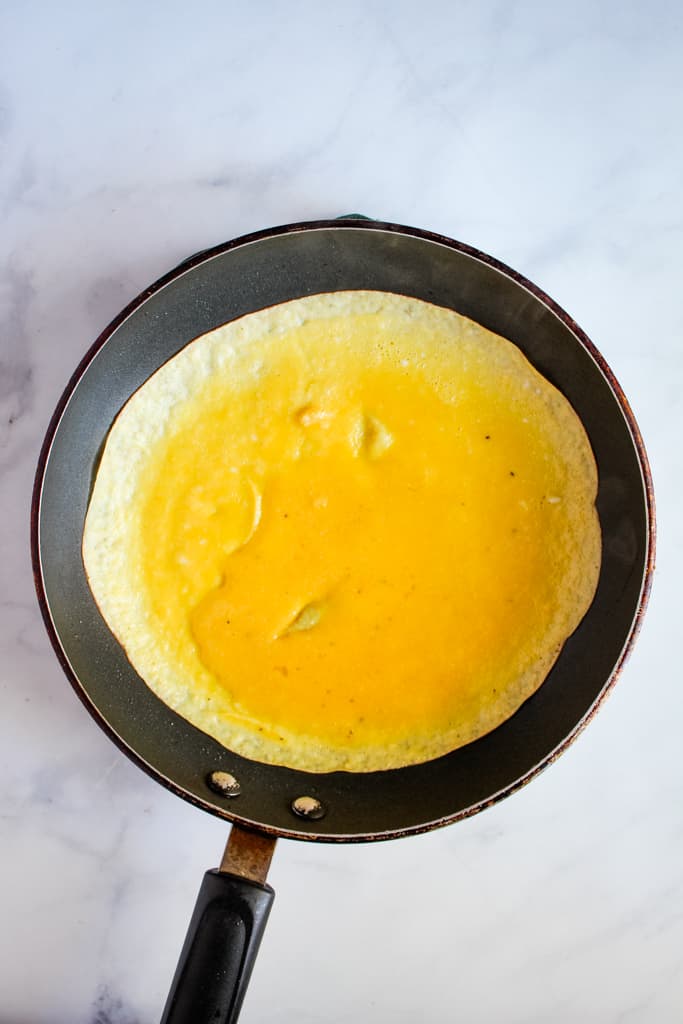 gluten free crepes cooking in a skillet