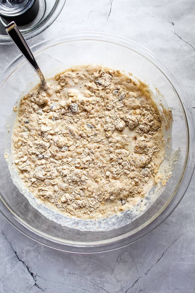 glass bowl of gluten free irish soda bread batter on a white countertop