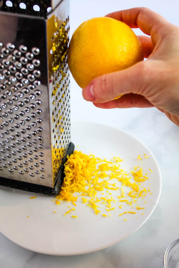 gluten free lemon blueberry scones lemon zest on a grater