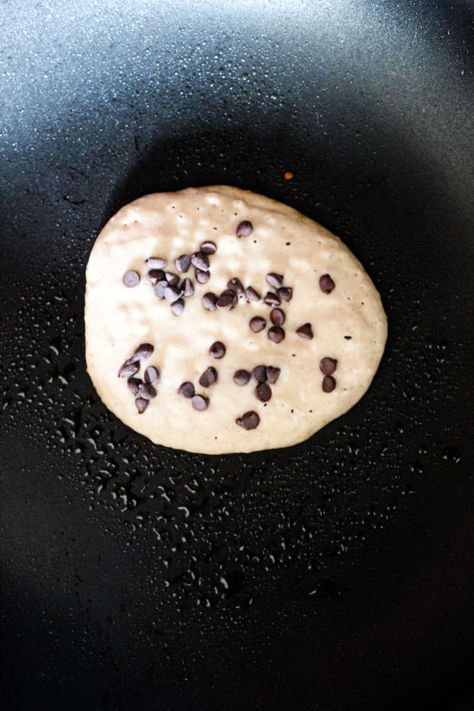 rice flour pancakes cooking in a skillet