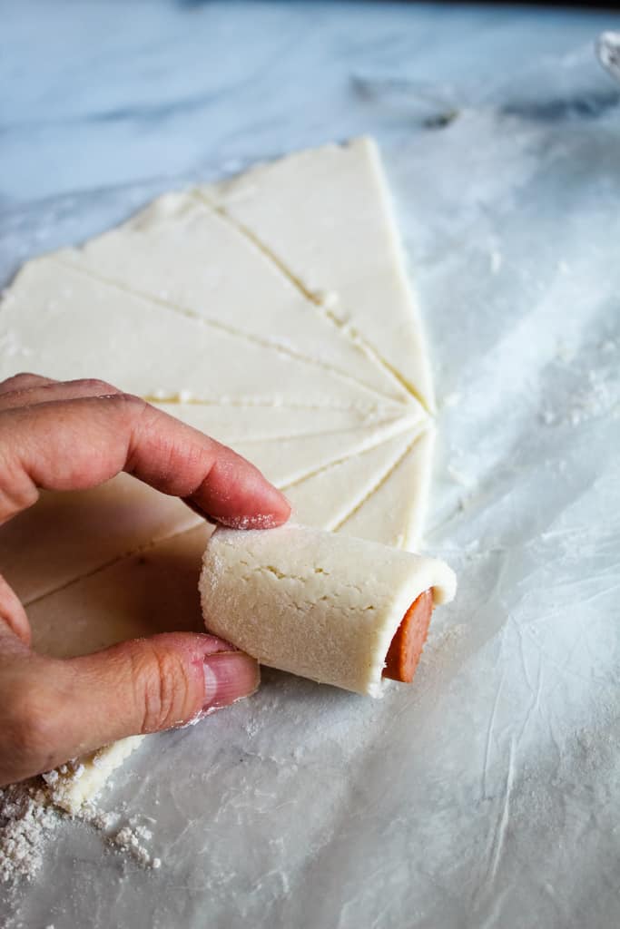 gluten free pigs in a blanket rolled on a white counter