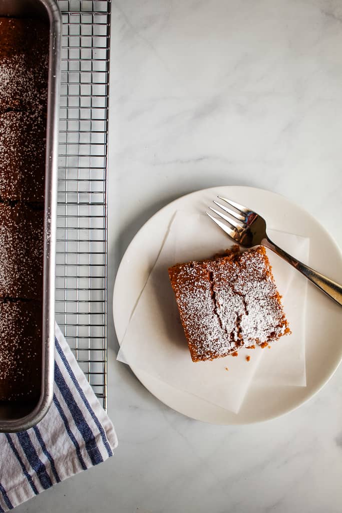 gluten free gingerbread slice on a white plate