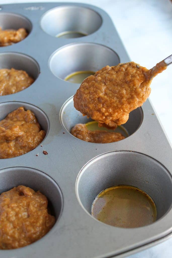 vegan pumpkin muffins in a baking pan.