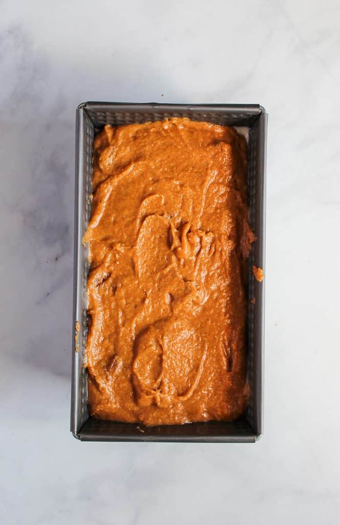 gluten free pumpkin bread batter in a baking pan.