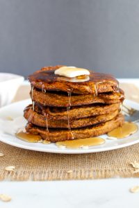 stack of glutn free pumpkin pancakes on a plate