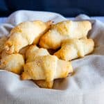 Gluten free crescent rolls sitting in a basket