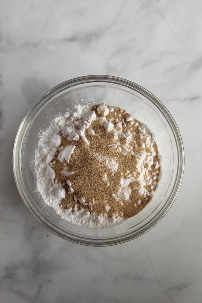 gluten free yeast rolls ready in under an hour mixing in a glass bowl