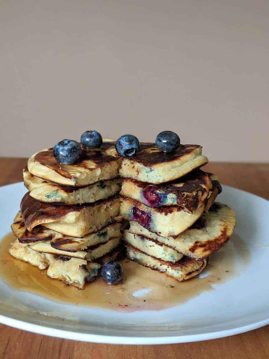 best gluten free blueberry pancakes topped with blueberries