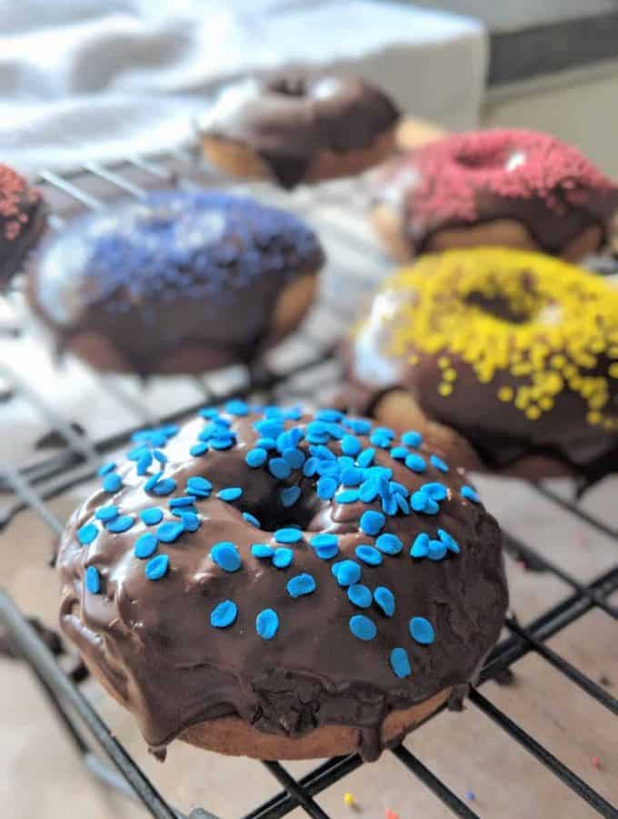 gluten free cake donuts baked with chocolate glaze on top.