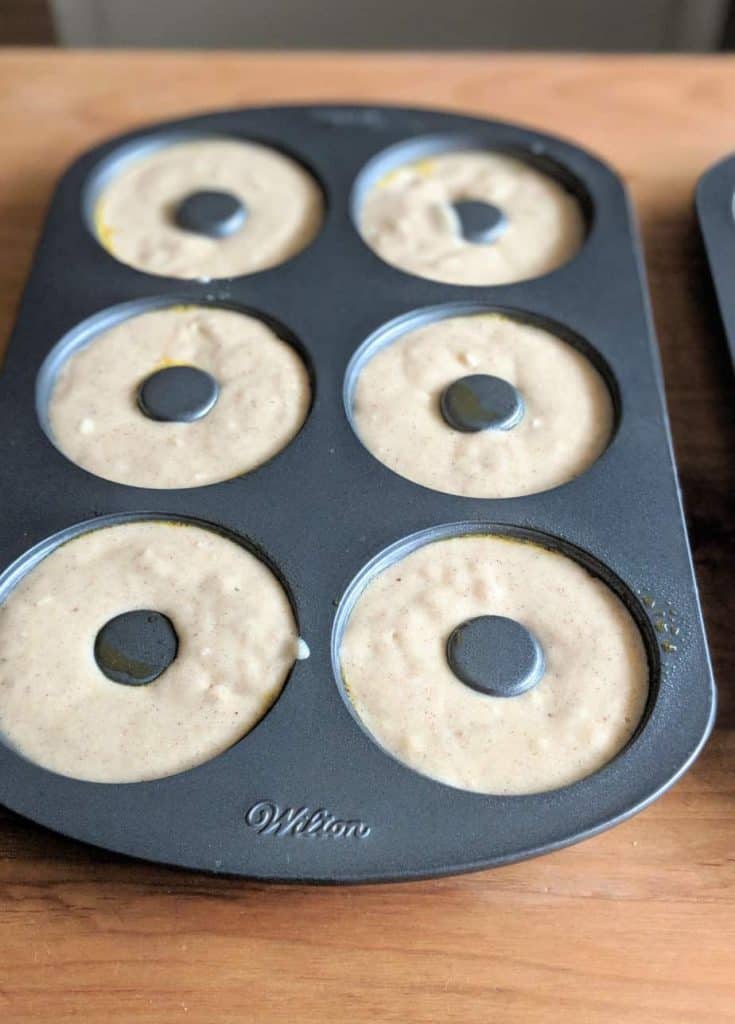 gluten free baked donuts batter in the baking pan.