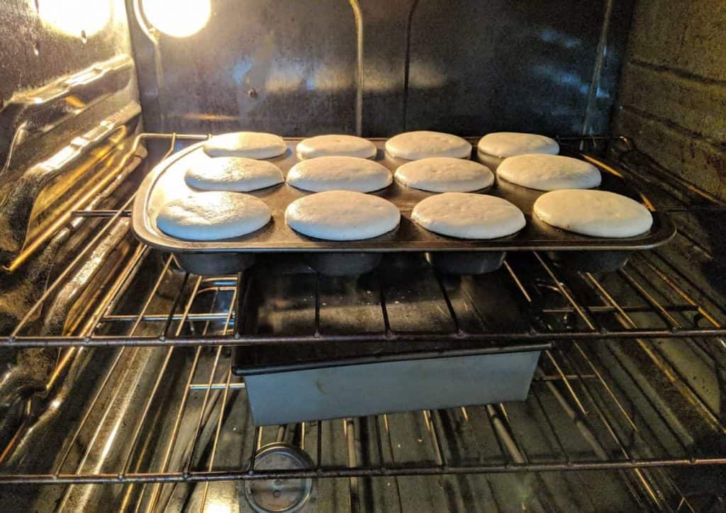 rolls baking in the oven in a metal pan