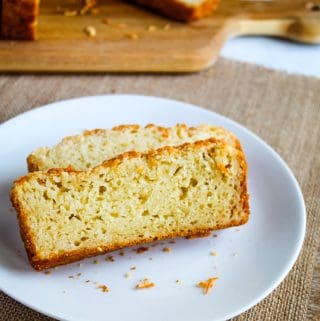 slice of gluten free garlic bread on a white plate