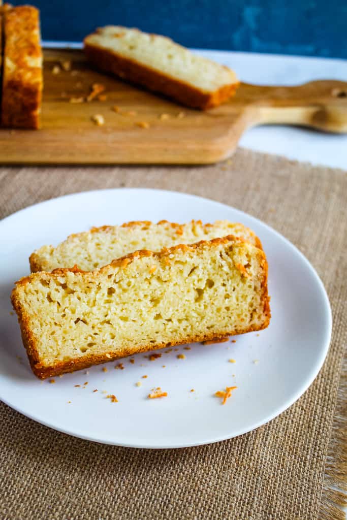 slice of gluten free garlic bread on a white plate