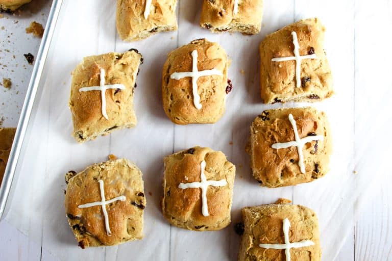gluten free hot cross buns on a cookie sheet