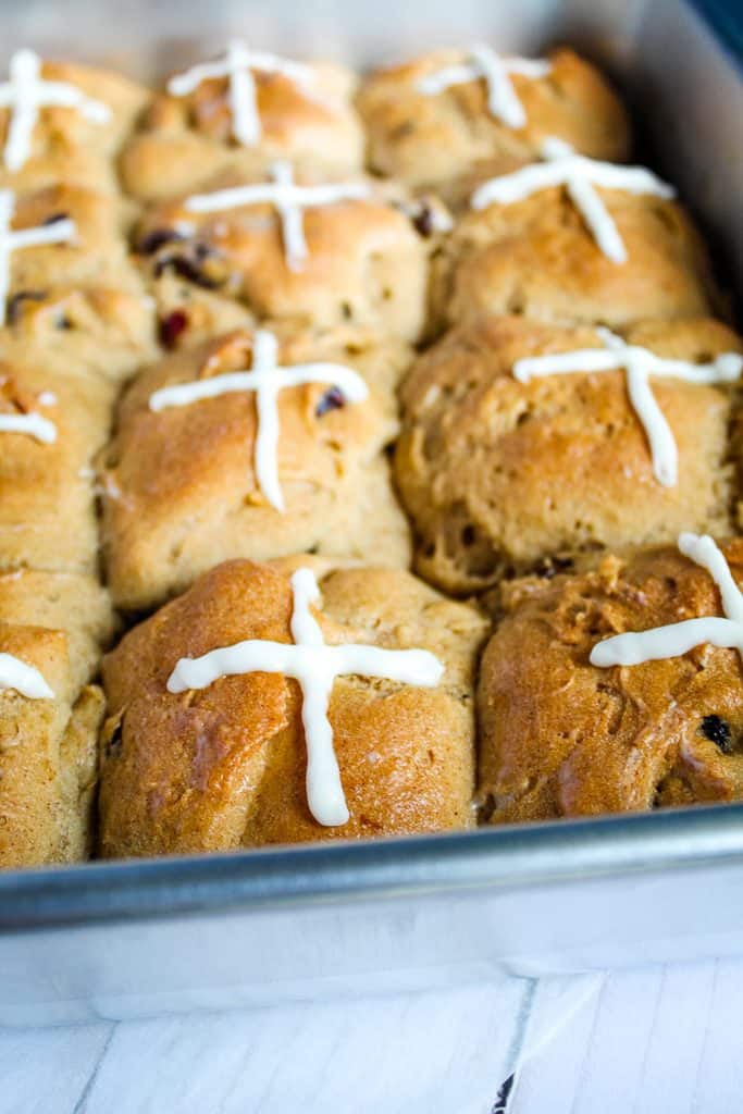 gluten free hot cross buns in a metal pan