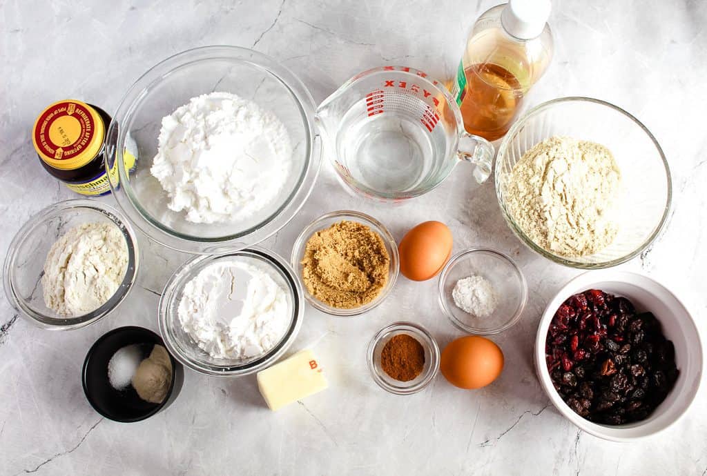 ingredients for gluten free hot cross buns on a white countertop