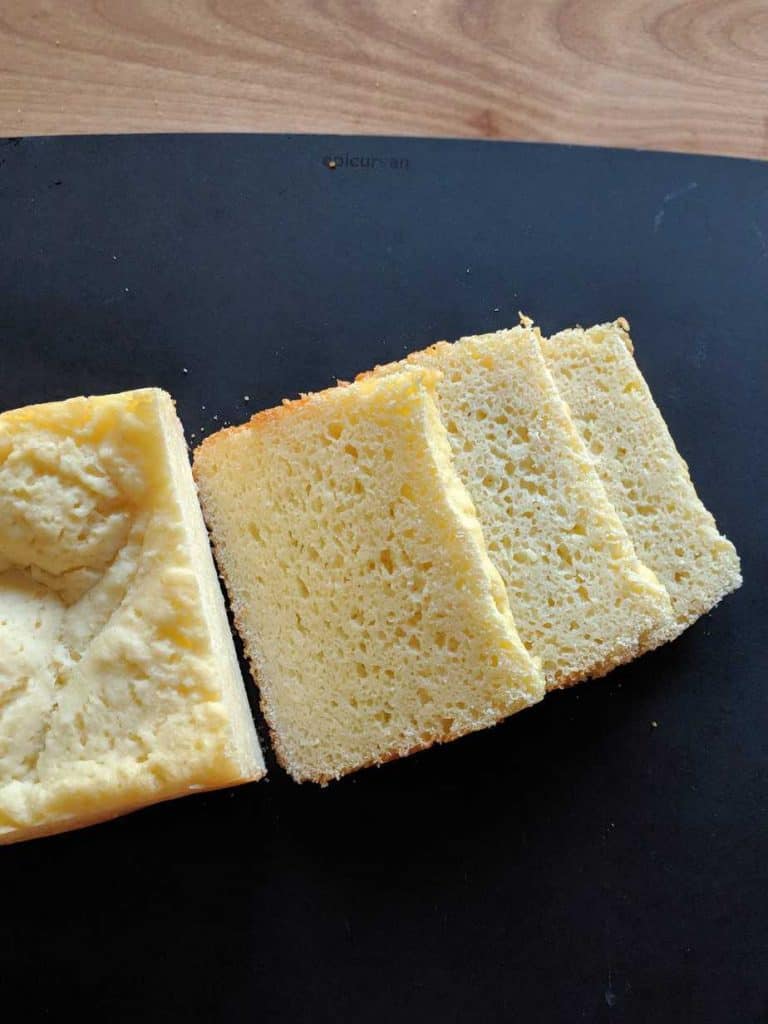 gluten free rice flour white bread bread machine sliced on a black board