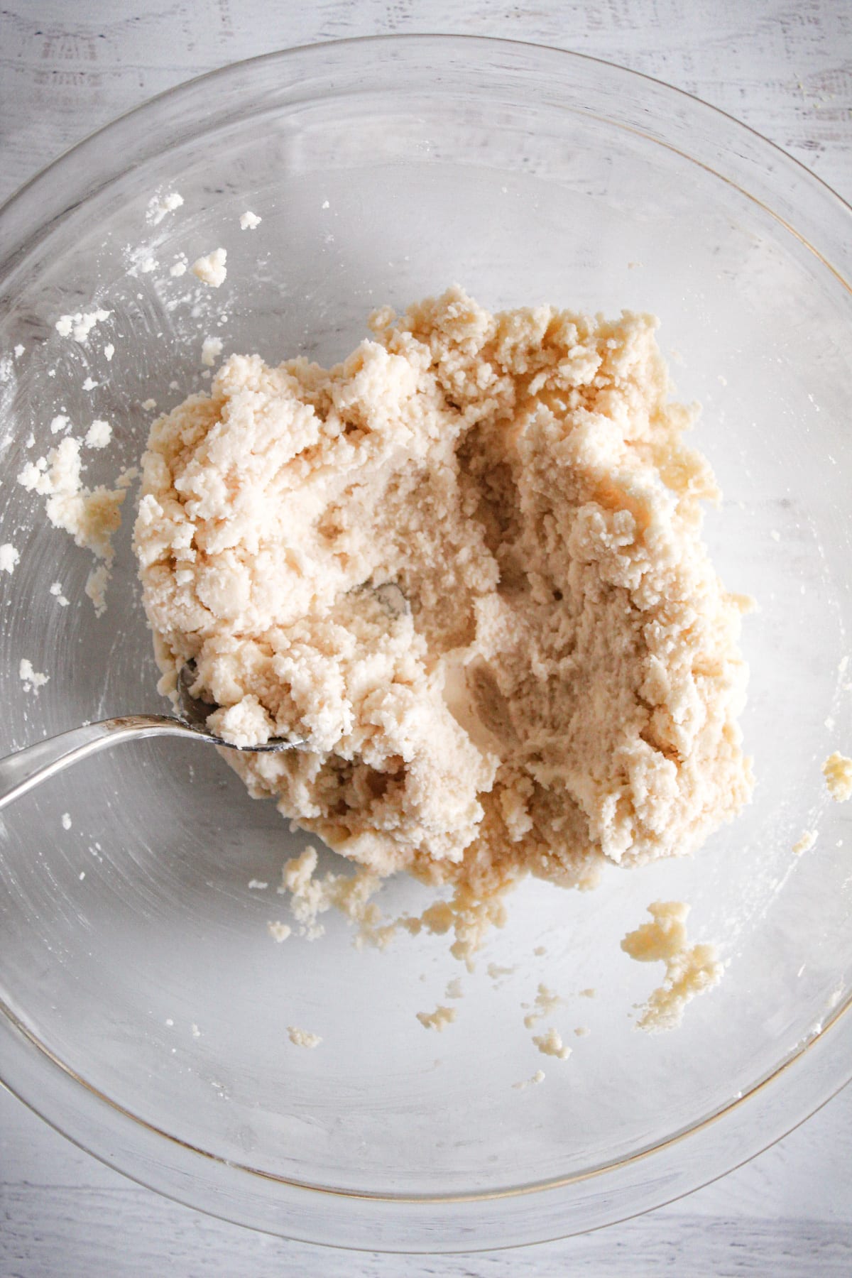 stirring dough in a bowl