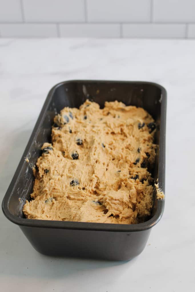 gluten free blueberry bread batter in the pan ready to bake