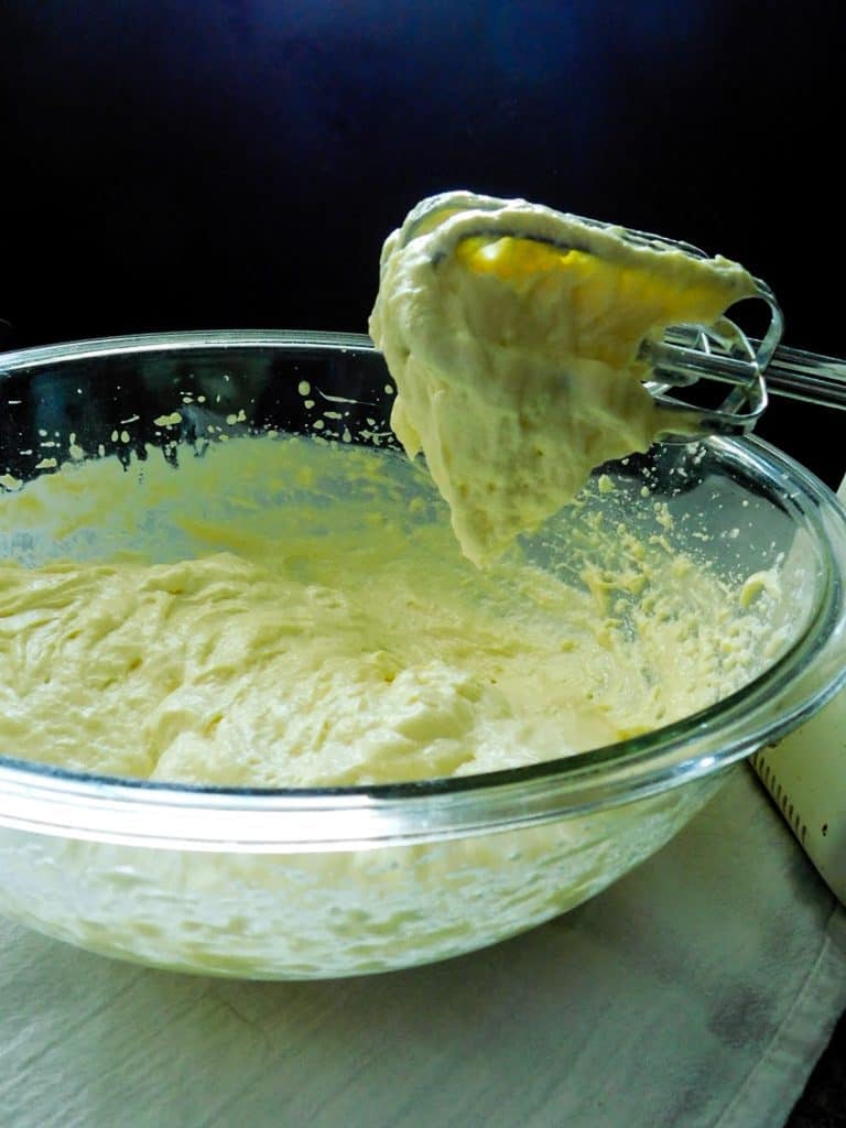 low carb bead batter stuck to a beater in a glass bowl.