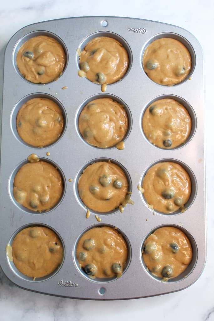 gluten free lemon blueberry muffins batter in pan