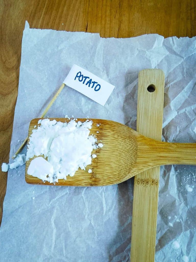 potato starch on a wooden spoon