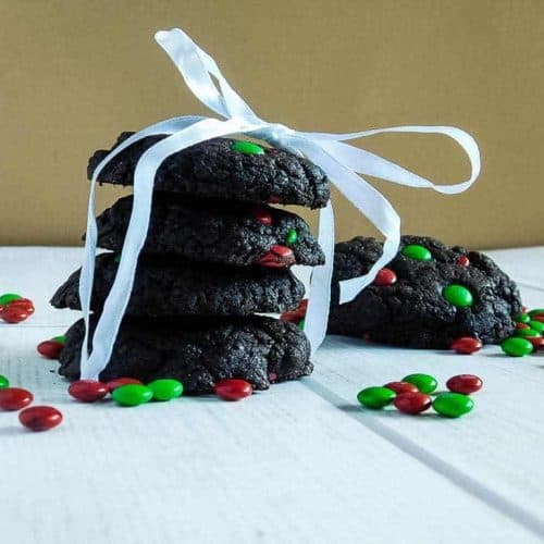 gluten free chocolate cake cookies wrapped in a ribbon on a white board