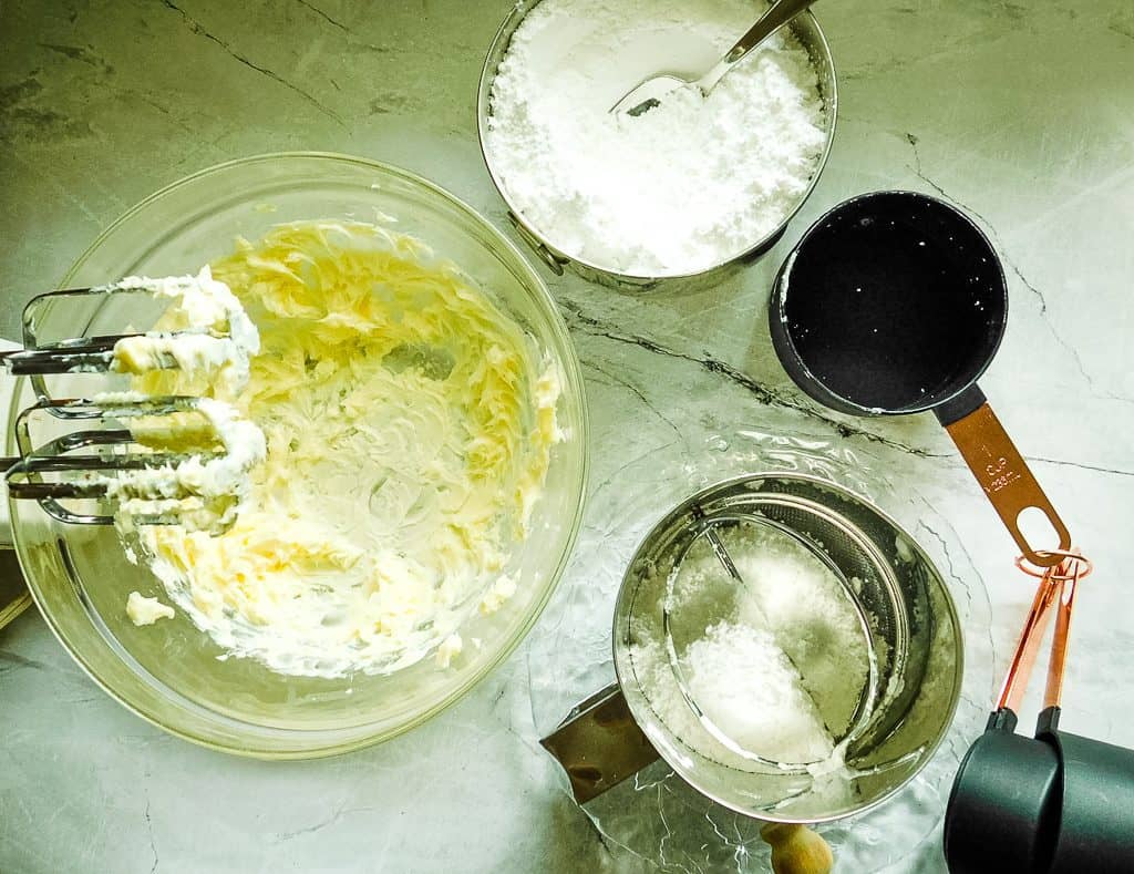 butter mixed in a glassbowl on a countertop