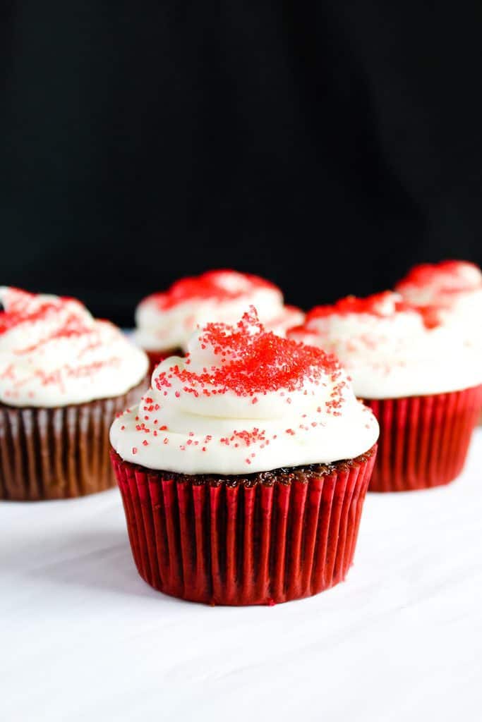 gluten free red velvet cupcakes in a red liner on a white counter