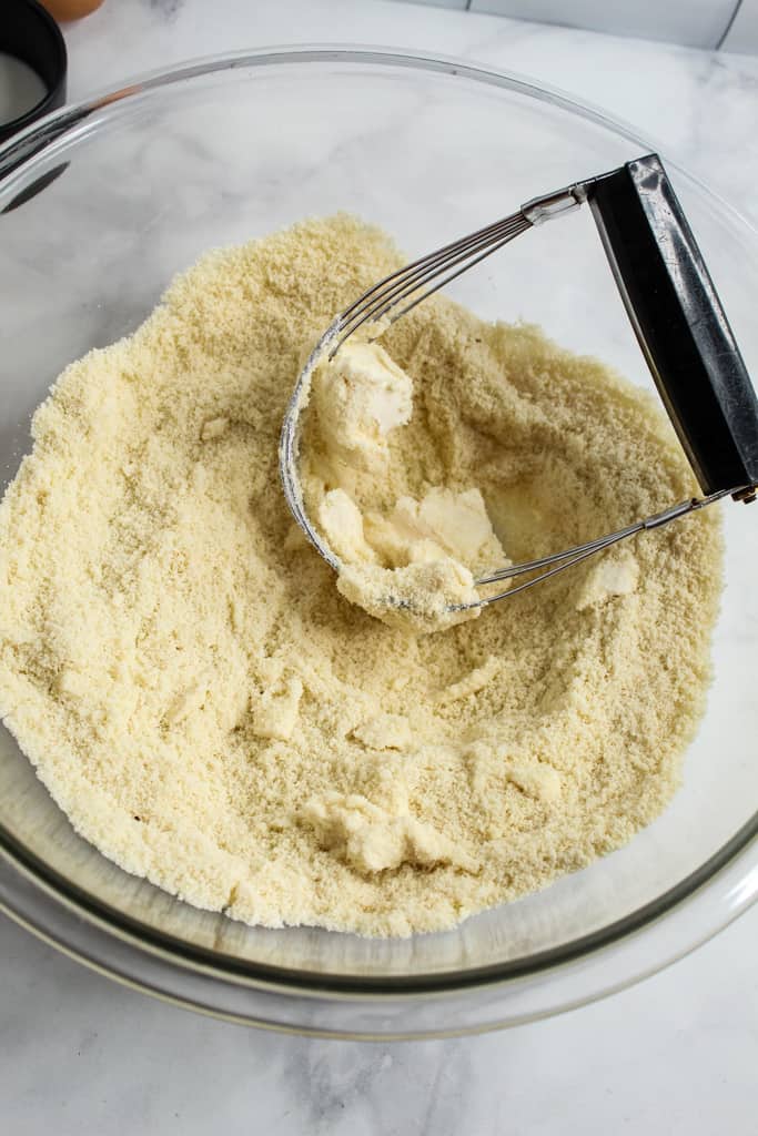 Almond Flour Biscuits cutting in butter