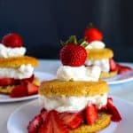 Gluten free strawberry shortcakes on a white plate ready to eat