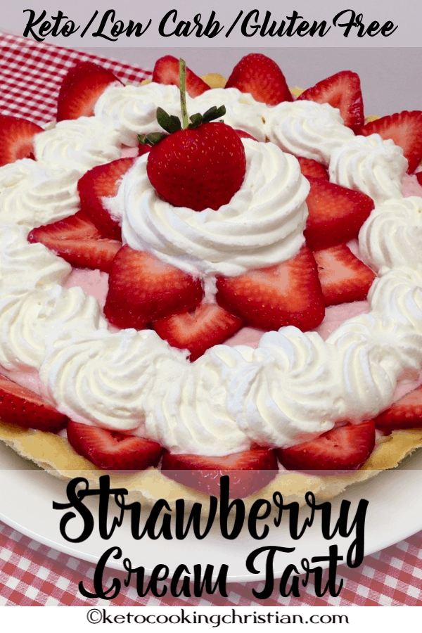 strawberry cream tart with whipped cream on a plate